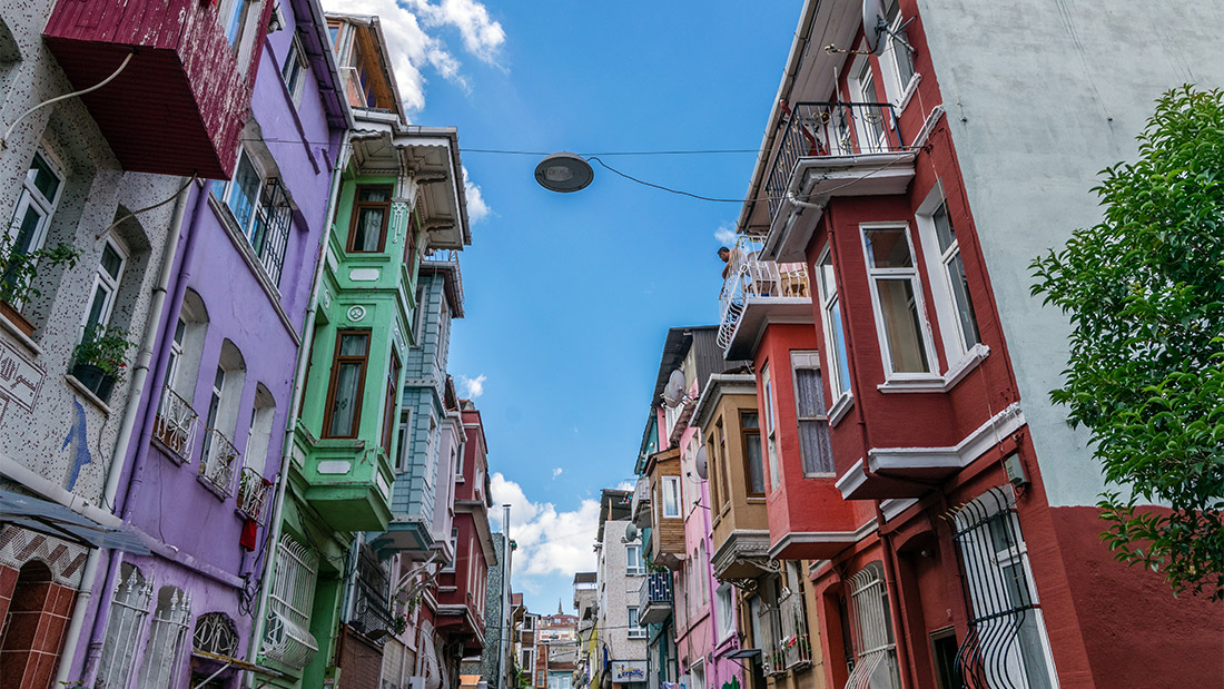 Vibrant multi-colored historic houses with traditional bay windows in the Fener and Balat districts of Istanbul